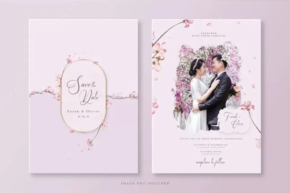 A pink and white wedding invitation with a photo of a couple.