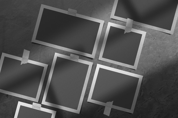 Arrangement of polaroids on a concrete wall